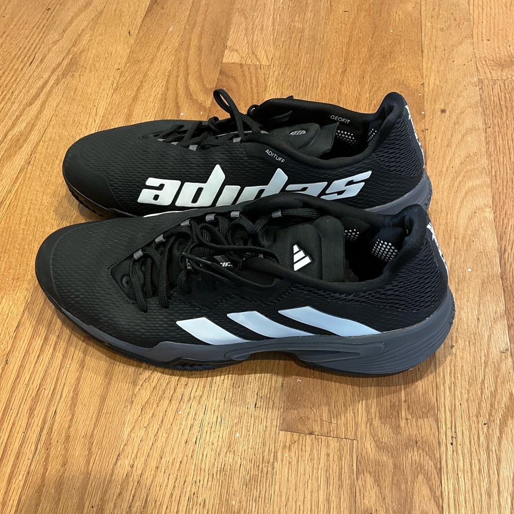 Men size 12 never been worn Adidas Black Athletic/Tennis Shoes